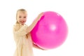 Little girl plays with a big ball for fitness Royalty Free Stock Photo