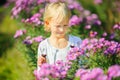 Beautiful little girl is playing with butterflies