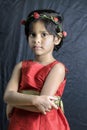 Beautiful little girl portrait with pink rose headband Royalty Free Stock Photo