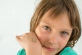 A beautiful little girl poses with a small lizard on her arm Royalty Free Stock Photo