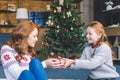 Girl presenting gift to mother Royalty Free Stock Photo