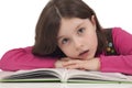 Beautiful little girl reading a book Royalty Free Stock Photo
