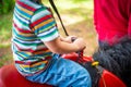 Beautiful little girl riding pony horse, view of holding with hands Royalty Free Stock Photo