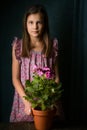 Girl with royal pelargonium