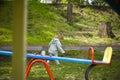 Beautiful little girl running around the playground from her mother Royalty Free Stock Photo