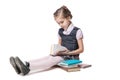 Beautiful little girl in school uniform with books Royalty Free Stock Photo