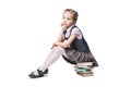 Beautiful little girl in school uniform with books Royalty Free Stock Photo
