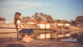 Cute child fishing on a lake in a sunny summer day