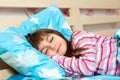 Beautiful little girl sleep in bed under a blue blanket Royalty Free Stock Photo