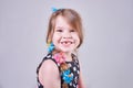 Beautiful little girl smiles a toothless smile Royalty Free Stock Photo