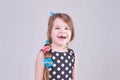 A beautiful little girl smiles a toothless smile Royalty Free Stock Photo