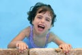 Beautiful little girl smiling in pool Royalty Free Stock Photo