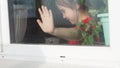 Beautiful little girl smiling and watching out the window. A child looks out the window. Portrait of cheerful kid. self Royalty Free Stock Photo