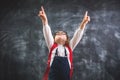 Beautiful little Girl Student making fingars up Gesture. Portrait of caucasian Smiling kid. Happy child looking up. Sale Royalty Free Stock Photo