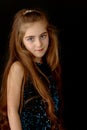 Beautiful little girl, studio portrait on a black background. Royalty Free Stock Photo