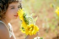 Beautiful little girl in a summer sunflower field Royalty Free Stock Photo