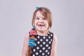 A beautiful little girl, surprised smiles a toothless smile Royalty Free Stock Photo