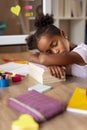 Girl sleeping at her desk Royalty Free Stock Photo