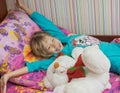 Beautiful little girl with a toy polar bear. Royalty Free Stock Photo