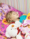 Beautiful little girl with a toy polar bear. Royalty Free Stock Photo