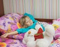 Beautiful little girl with a toy polar bear. Royalty Free Stock Photo