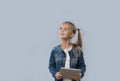 Beautiful Little Girl Using Tablet Computer Looking Up To Copy Space Happy Smiling Isolated Royalty Free Stock Photo