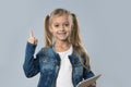 Beautiful Little Girl Using Tablet Computer Point Finger Up To Copy Space Happy Smiling Isolated Royalty Free Stock Photo