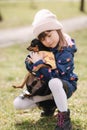 Beautiful little girl walk with cute dog outdoors. Six year old girl hug her pet Royalty Free Stock Photo