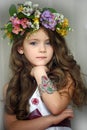 Beautiful little girl wearing a wreath of flowers Royalty Free Stock Photo