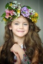 Beautiful little girl wearing a wreath of flowers Royalty Free Stock Photo