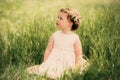 Beautiful little girl in wreath of flowers Royalty Free Stock Photo