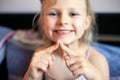 A beautiful little girl of 6-7 years old lost the first milk tooth. Loss of primary teeth, replacement of teeth with permanent Royalty Free Stock Photo