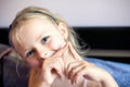 A beautiful little girl of 6-7 years old lost the first milk tooth. Loss of primary teeth, replacement of teeth with permanent Royalty Free Stock Photo