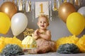 Beautiful little girl in yellow dress with sweet cake Royalty Free Stock Photo