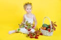 Beautiful little happy girl with basket of vegetables and fruits Royalty Free Stock Photo