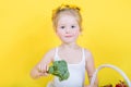 Beautiful little happy girl with basket of vegetables and fruits Royalty Free Stock Photo