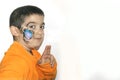 Beautiful little kid boy with face painted with a spider Royalty Free Stock Photo