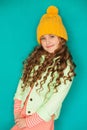 Beautiful little lady in yellow woolen cap