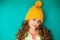 Beautiful little lady in yellow woolen cap
