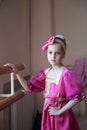 Beautiful little russian girl in traditional costume barre exercise in ballet dance school Royalty Free Stock Photo