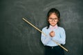 Beautiful little teacher pointing someone rebukes