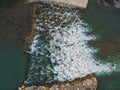 Beautiful Little Waterfall on the Drome River formed from great stones in a mountainous region. A waterfall during the sunset. Royalty Free Stock Photo