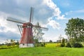 Beautiful windmill in Drenthe Netherlands with dark clouds at background