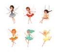 Beautiful little winged fairies set. Cute girls with wings in colorful dresses cartoon vector illustration Royalty Free Stock Photo