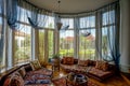 Beautiful living room interior with high windows