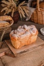 Beautiful loaf of white bread on wooden background