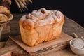 Beautiful loaf of white bread on wooden background