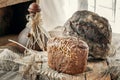 Beautiful loaves of bread on a leaven of white wheat on a plate on the edge of the canvas. Homemade cakes, handmade. Close up Royalty Free Stock Photo