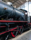 Beautiful locomotive. It is a vintage steam train of black and red color, exposed on the track itself Royalty Free Stock Photo