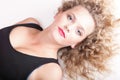 Beautiful long blond curly hair of young attractive woman